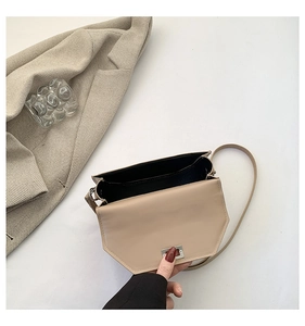 Detailed interior view of the khaki quilted flap bag with metallic silver lock