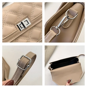 Detail view of beige quilted handbag with silver swivel lock and adjustable strap buckle