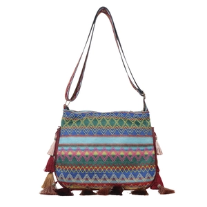 Colorful hand-woven crossbody bag with geometric patterns and fringe tassels