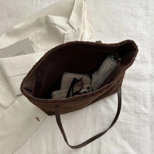 Large dark brown plush tote bag with leather straps and spacious interior for daily items