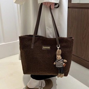 Large dark brown plush tote bag with fashion leather tag and cute rabbit charm detail