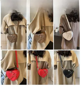 Selection of heart-shaped crossbody bags in brown, beige, red, and black colors