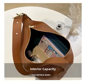 Internal capacity of caramel brown leather shoulder bag showing ample storage space