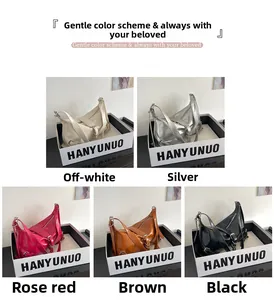 Detailed view of fashionable hobo bags in off-white, silver, rose red, brown, and black colors