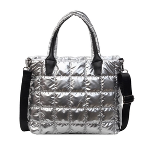 Silver quilted tote bag with metallic finish and black adjustable nylon shoulder straps