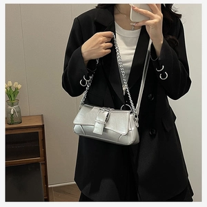 Silver metallic crossbody bag with textured crackle finish and chain strap details