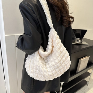 Chic off-white quilted puffer hobo bag with unique bubble texture for daily commute style