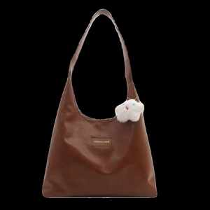 Brown leather tote bag for women with fashion label and white plush cloud charm accessory