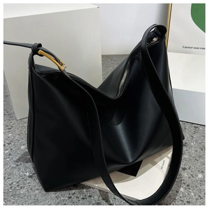 Close-up of black leather hobo bag featuring premium texture and gold square buckle