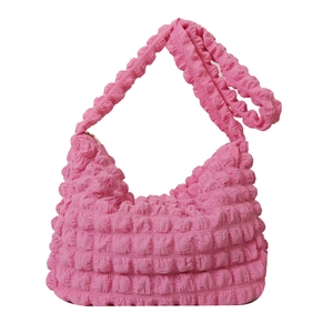 Pink bubble textured pleated shoulder bag with wide strap on a clean white background
