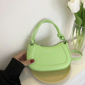 Lime green textured dumpling bag with chain strap and silver fashion text accent