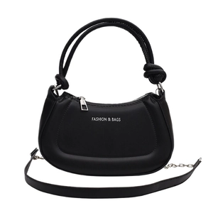 Chic black crescent shoulder bag with white lettering and chain strap in white background