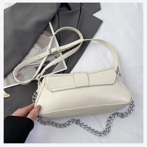 Detail of off-white rectangle shoulder bag with silver chain and adjustable leather strap