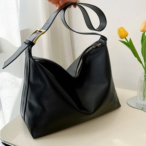 Large black minimalist PU leather tote bag with gold buckle and silver zipper closure