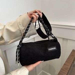 Black corduroy cylinder crossbody bag with woven rope strap and fashion patch for women