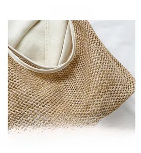 Close-up of woven straw tote bag showing tight natural fiber texture and fabric lining