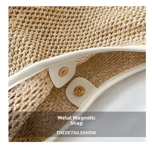Detail of premium straw weave bag showing secure gold magnetic snap closure hardware