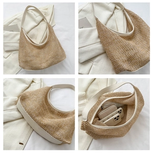 Detail showing the large capacity straw tote bag with leather trim and woven texture