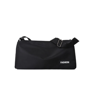 Minimalist black nylon crossbody bag with adjustable strap and fashion label detail