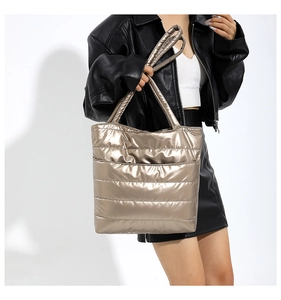 Detailed view of champagne gold quilted puffer tote bag with large capacity for commuting