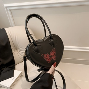 Minimalist black heart leather handbag with red butterfly print and double top handles