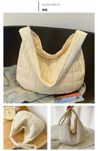 Detailed close-up of beige quilted hobo bag featuring soft padded texture and wide strap