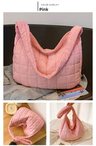 Close-up of pink quilted down tote bag showing high-quality stitching and nylon texture