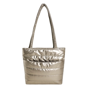 Champagne gold quilted puffer tote bag with metallic nylon finish and long shoulder strap