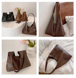 Macro shot of minimalist PU leather tote bag details in black, light brown and dark brown