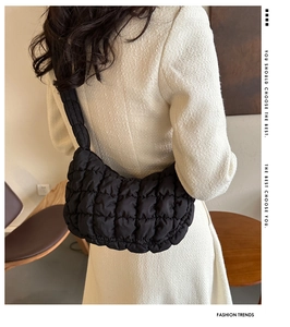 Detail of black quilted cloud bag showing the unique 3D bubble texture and nylon fabric