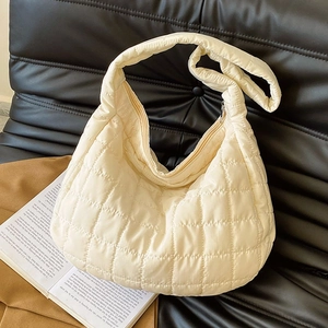 Chic cream quilted down puffer tote bag with large square stitching and soft texture