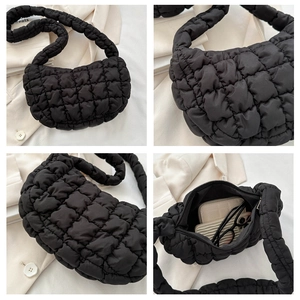 Detailed view of black quilted puffer hobo bag with spacious interior for daily essentials
