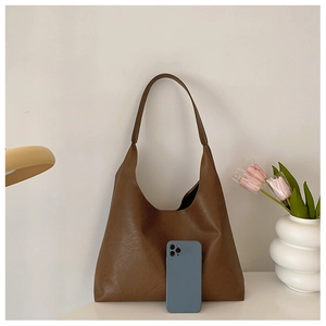 Deep brown large capacity tote bag shown with a smartphone to demonstrate interior space
