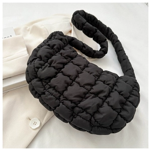 Detail of black cloud bubble bag with puffy quilted texture and hobo shoulder strap