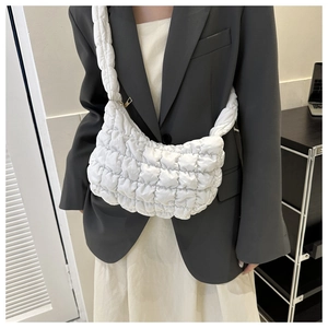 Quilted white shoulder bag made of waterproof nylon fabric with soft puffer texture