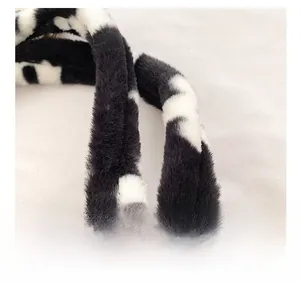 Close-up of soft cow print plush shoulder strap showing fluffy texture and premium detail