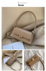 Vue détaillée d'un sac à main kaki en similicuir avec fermoir métallique doré élégant