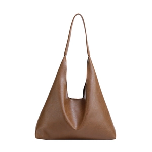 Minimalist caramel brown PU leather oversized tote bag with vintage shoulder strap design