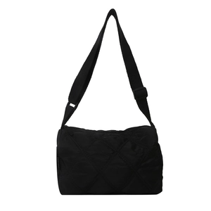 Minimalist black quilted nylon crossbody bag with diamond stitch and adjustable strap