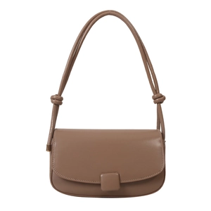 Minimalist warm brown flap crossbody bag with square buckle and knotted strap detail