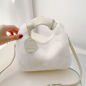 Premium cream plush handbag with faux fur texture and elegant leather handle