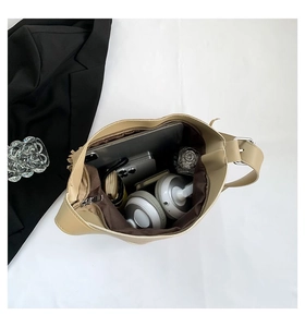 Top view of a large khaki tote bag showing spacious interior for tablets and daily items