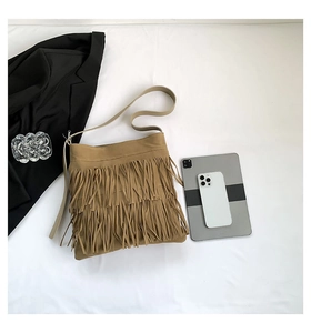 Top view of khaki fringe tote bag with bohemian tassels and long shoulder straps