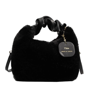 Elegant black faux fur handbag with ruched leather handle and gold chain detail
