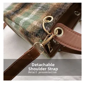 Close-up of checkered tweed bag detail with golden hardware and detachable shoulder strap