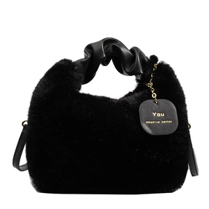 Chic black plush tote bag with ruched faux leather handle and gold chain detail