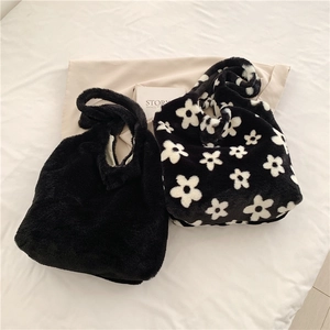 Plush faux fur tote bags in solid black and floral pattern with soft handles