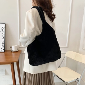 Chic black faux fur tote bag for women featuring a large capacity and soft plush texture