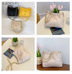Close-up of quilted PU leather bags with drawstring closure and metal chain straps