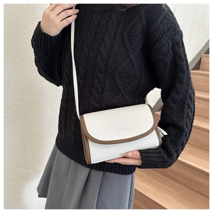 Fashion small square crossbody bag in white and brown contrast leather on model